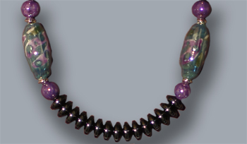 Amethyst beads, fancy beads, hematite lentils; 20 inches long